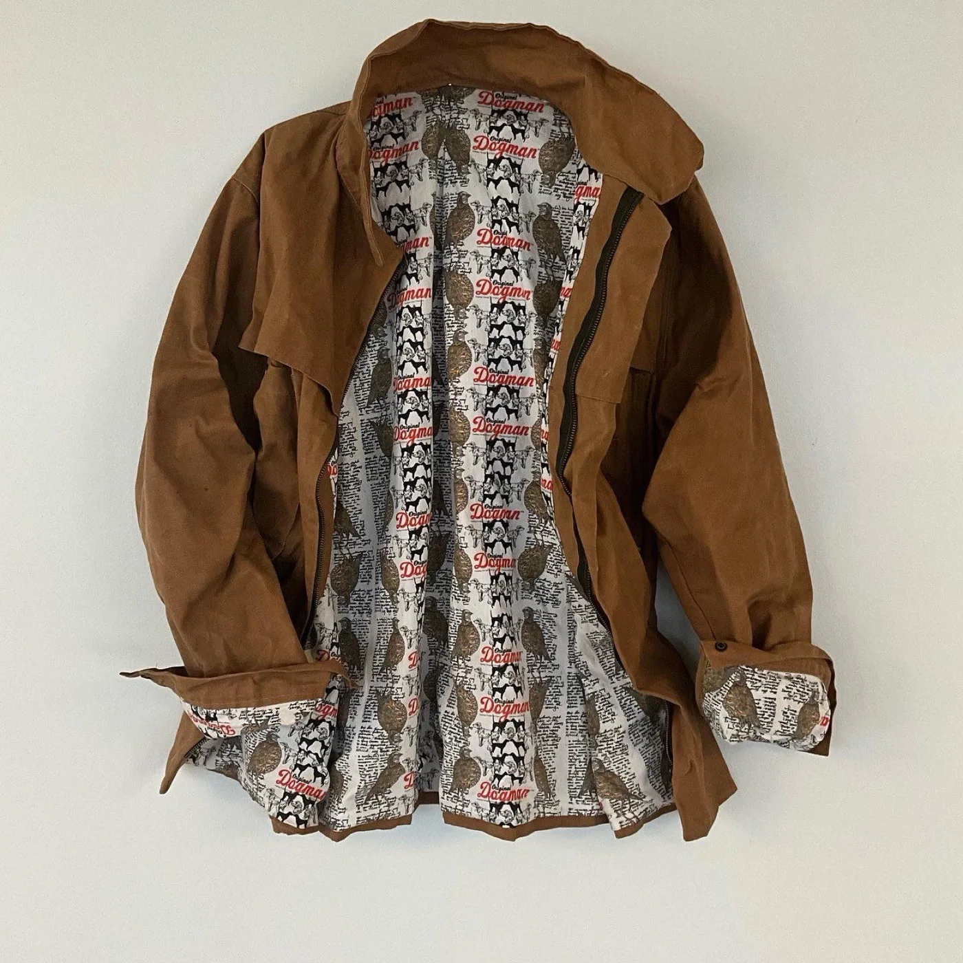 Original Dogman Waxed Cotton Jacket, open, showing the custom-printed lining.